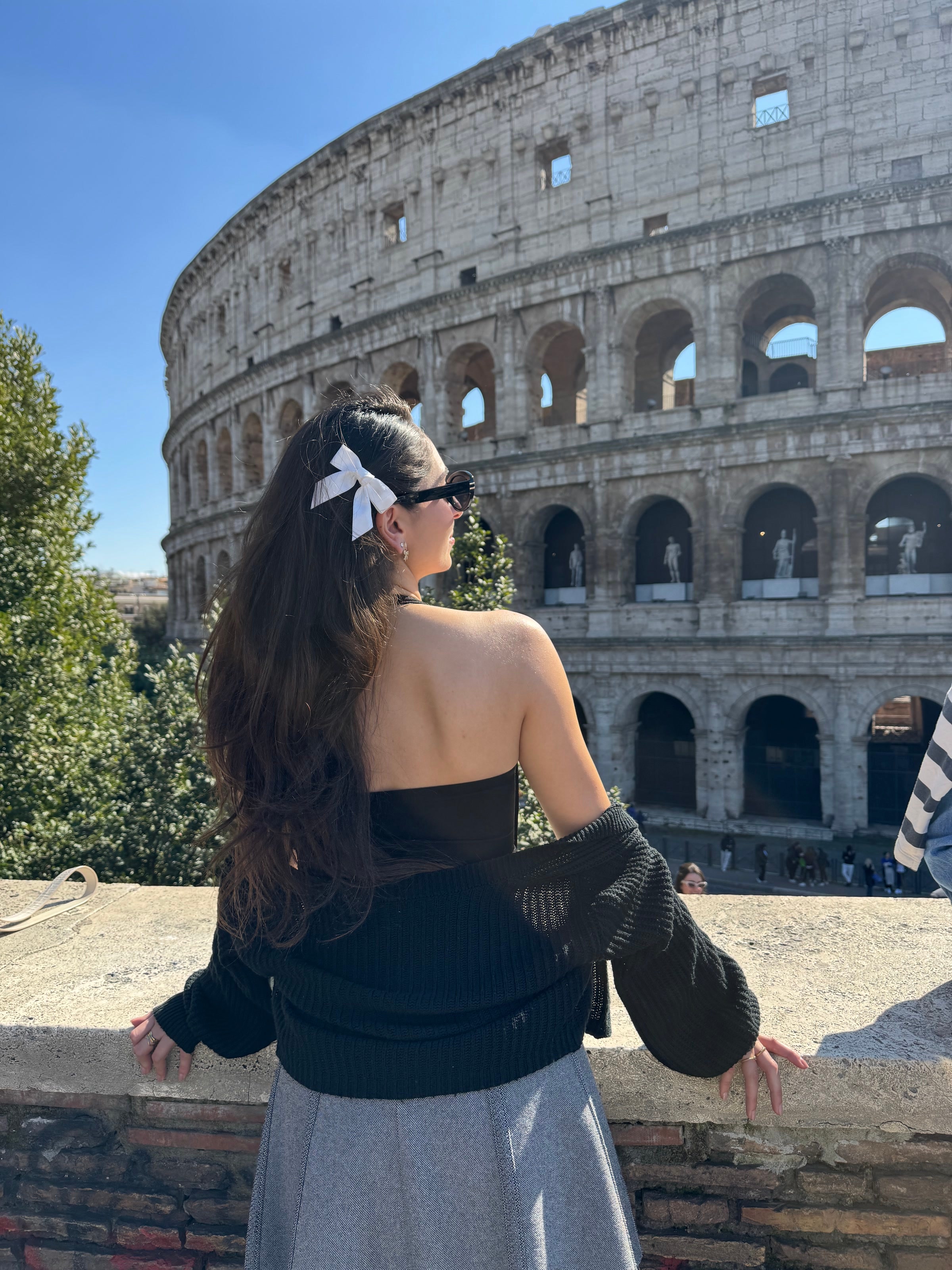 Tereza photographed in front of the Colosseum.