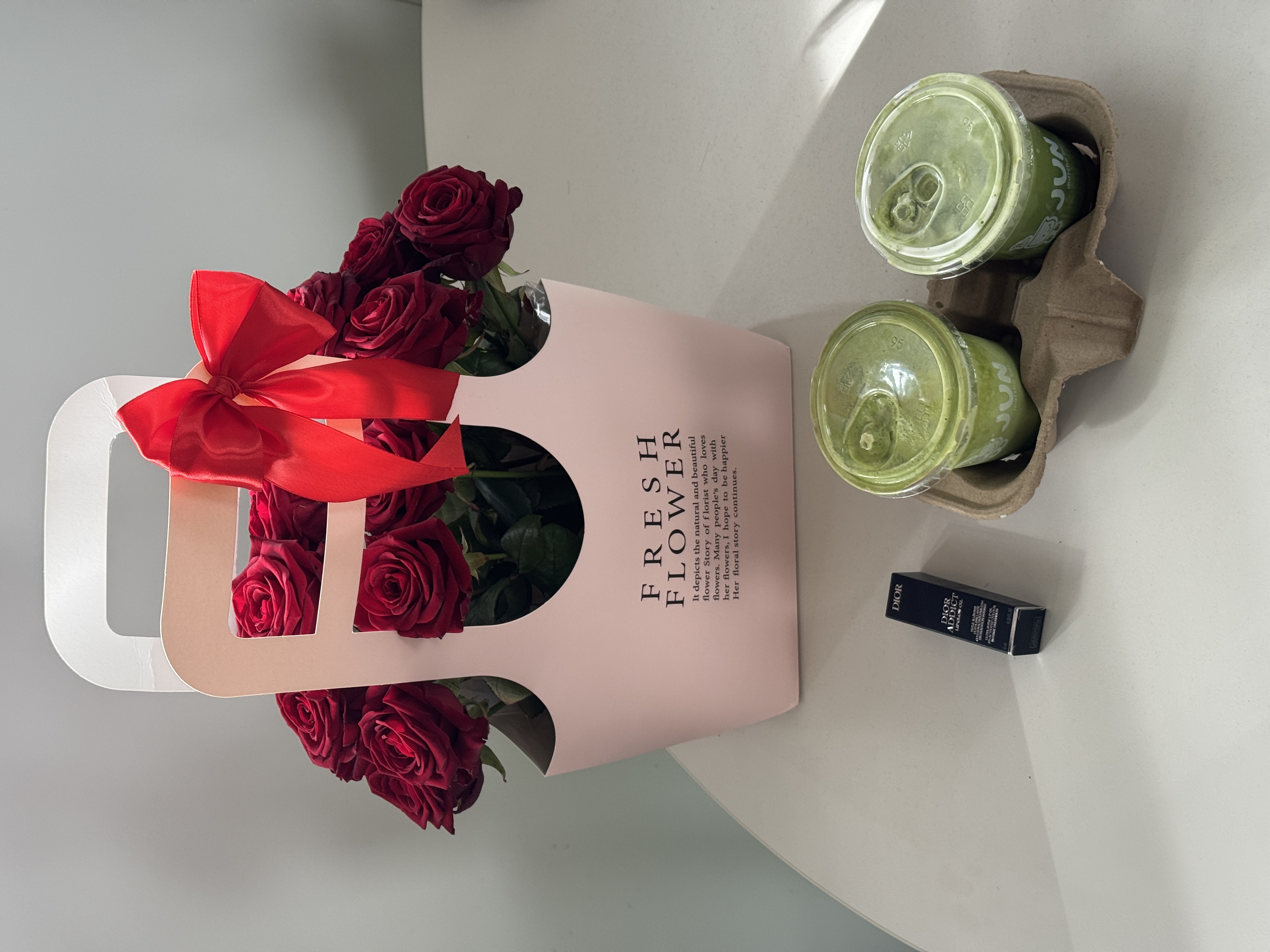 Rose bouquet and drinks still life.