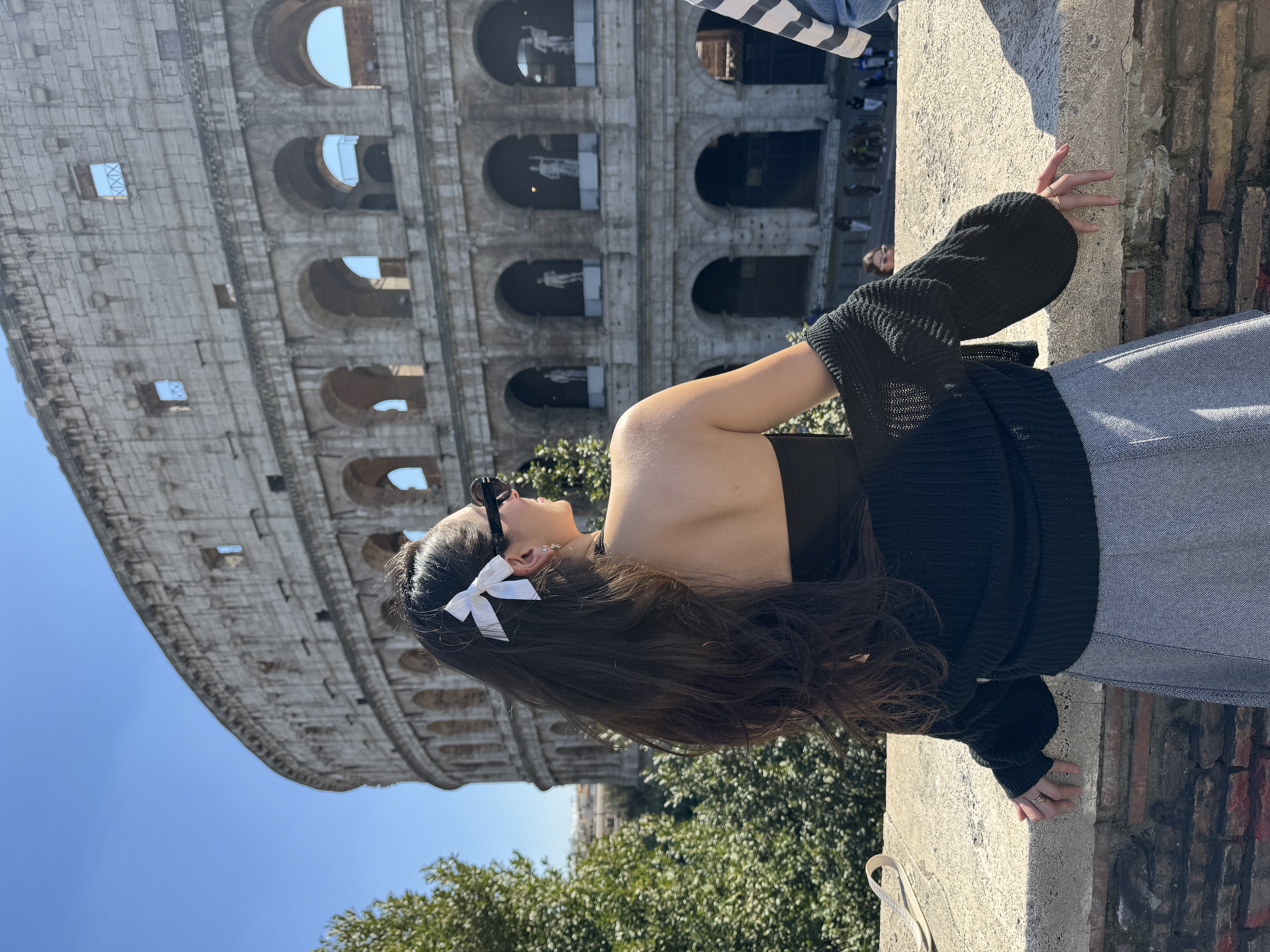 Tereza photographed in front of the Colosseum.